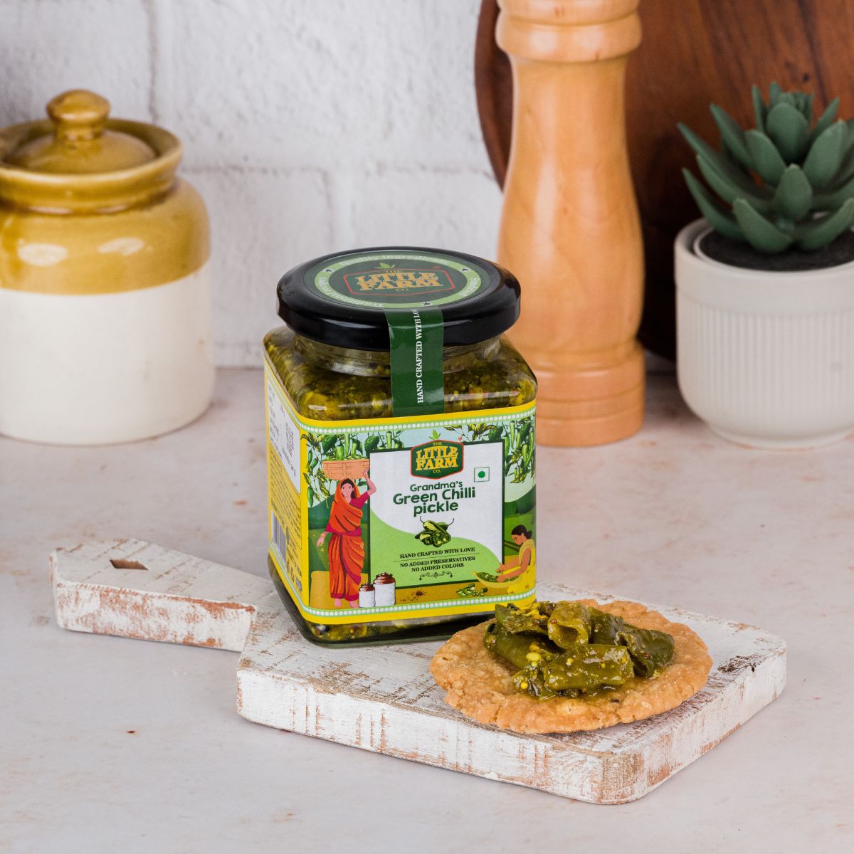 This flavourful green chilli pickle has black mustard, jeera, saunf, methi, hing, lemon juice, turmeric, garam masala and rock salt preserved traditionally with mustard oil